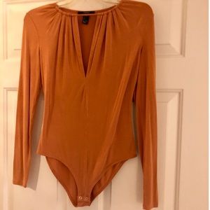 Burnt orange long sleeve body suit